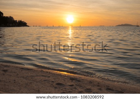 Beautiful sunset above the sea beach