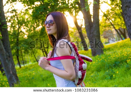 girl with rabbit`s backpack