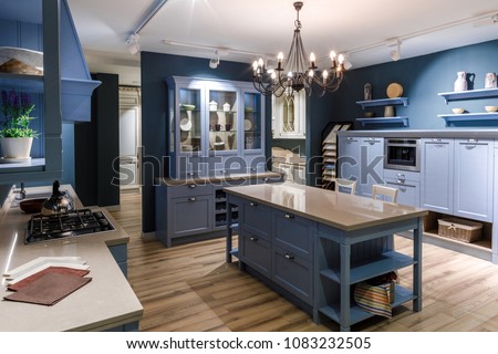 Renovated kitchen interior in blue tones Royalty-Free Stock Photo #1083232505