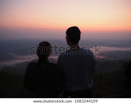 silhouette couple pictures on mountain, the mist of sea on mountain 