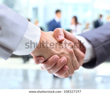 Business handshake and business people Royalty-Free Stock Photo #108327197
