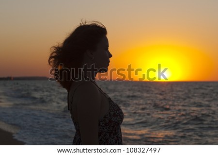 carefree woman in the sunset on the beach. vacation vitality healthy living concept