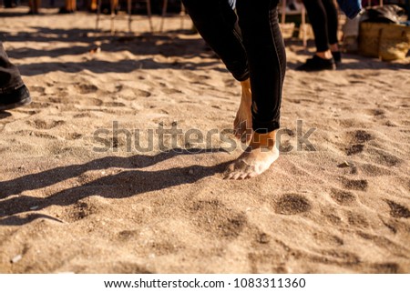 clouse up of dancing feet at beach party