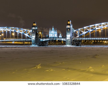 Frozen Neva River with the Bolsheokhtinsky Bridge and the Smolny Cathedral in the background. In St. Petersburg, Russia 