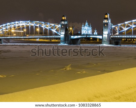 Frozen Neva River with the Bolsheokhtinsky Bridge and the Smolny Cathedral in the background. In St. Petersburg, Russia 