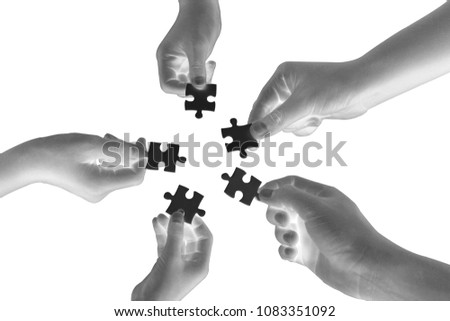 hands holding piece of blank jigsaw puzzle on white background for growing business  concept