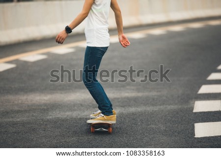 Skateboarder  skateboarding  on highway