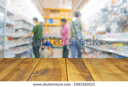blurred photo wood table on supermarket store on background with bokeh