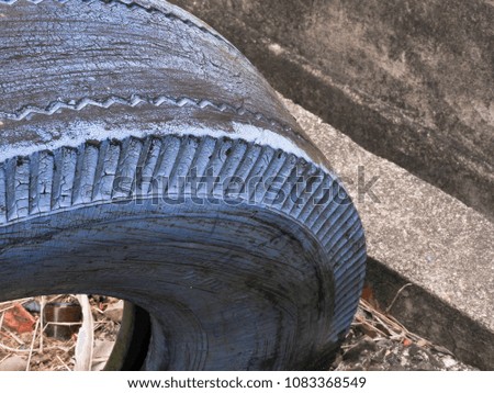 Old curve recycled,used tires painted with blue color paint.Wheel texture.