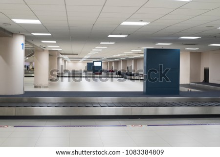 Empty baggage conveyor belt at the airport Royalty-Free Stock Photo #1083384809