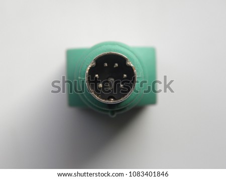 Top view of connector of green color USB to keyboard and mouse adapter