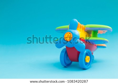 Toys model plane, Airplane colorful model on blue background.