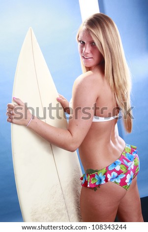 Young surfer and board