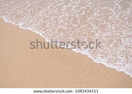 Copy space smooth wave beach with sand texture abstract background. Summer vacation and business travel relax concept.