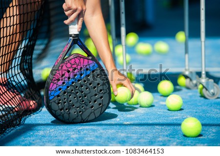 close-up of balls and paddle racket  Royalty-Free Stock Photo #1083464153