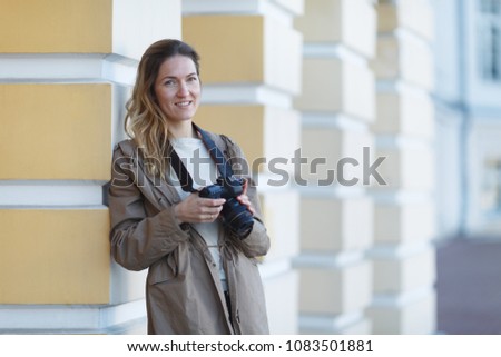woman with camera on the street