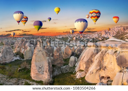 Hot air balloons at sunset over the cave town, Cappadocia, Turkey