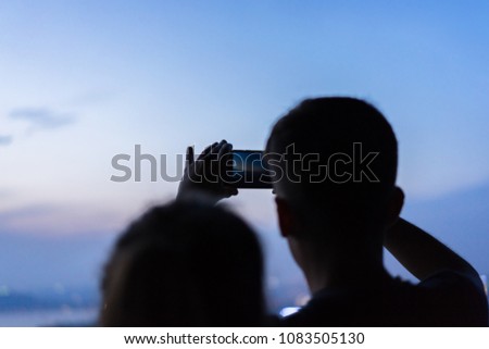 young man take photo with smartphone