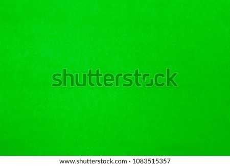 Green pastel color paper laying as background  and template.