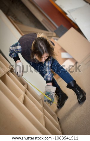 Woman carpenter works in carpentry