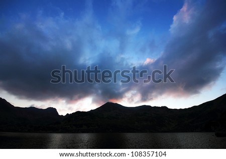 Sunset light over Bucura Lake, National Park Retezat, Romania