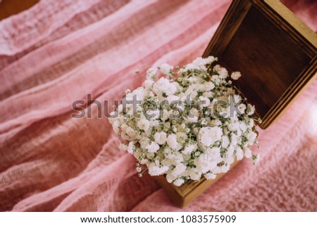 wedding rings for lovers in a box with white flowers