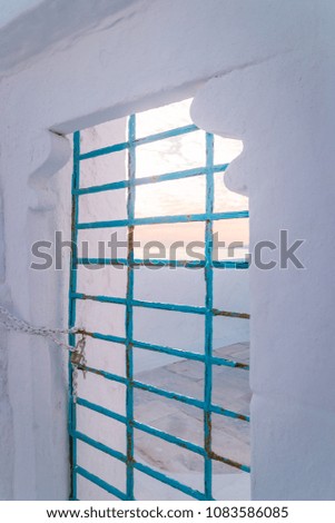 bleu lock with window bars at Mykonos during sunset