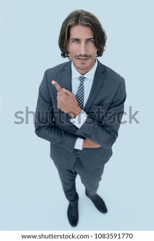 Handsome businessman showing finger point up