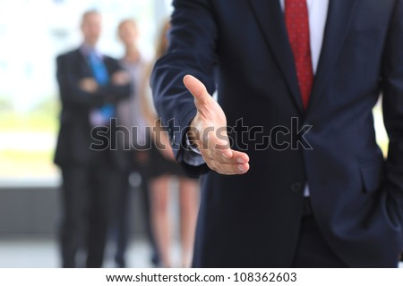 A business man with an open hand ready to seal a deal Royalty-Free Stock Photo #108362603