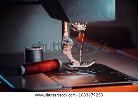 Production line sewing machine. Needle and footstep detail Royalty-Free Stock Photo #1083679253