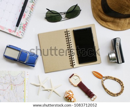 Outfit of traveler on white background with copy space - Stock image
Map, Planning, Camera  Clothing, Concepts,Notebook,Men's Watch,phone