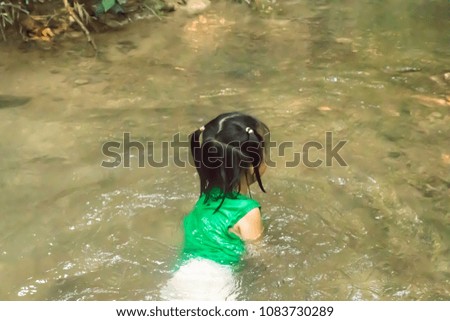 Blurred girl is playing and swimming.