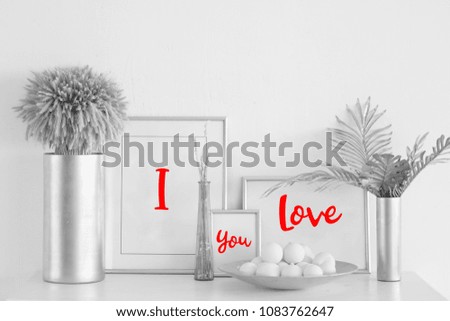Black and white composition of frames and vases with plants: I love you