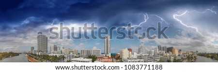 Miami Beach sunset skyline, panoramic aerial view on a stormy day from Canal.