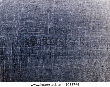 Stock macro photo of the texture of scratched metal.
