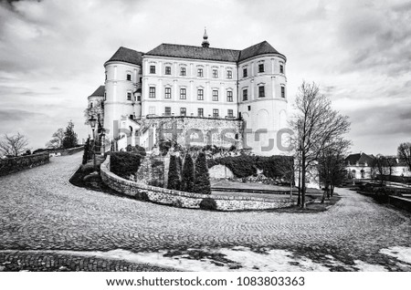 Mikulov castle, southern Moravia, Czech republic. Travel destination. Architectural scene. Black and white photo.
