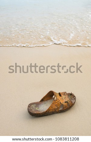 Old shoe on the beach,worthless.