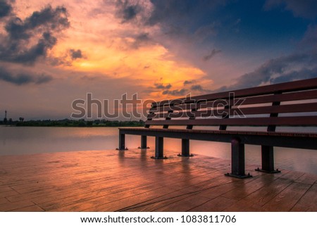 Waterfront Bridge with Sunset