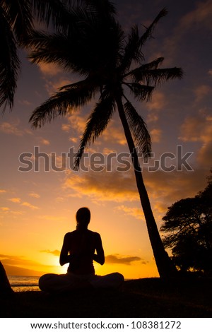 Yoga women silhouette, working on poses at sunset