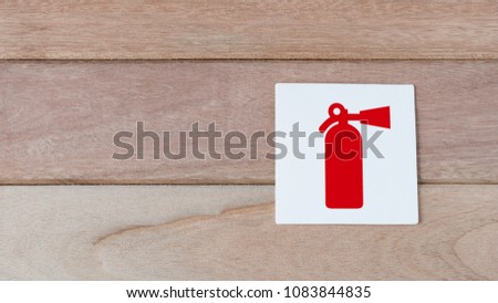 fire extiguisher sign on wood wall with space for adding text on the left side