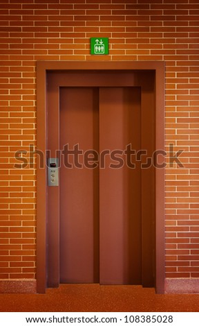 Elevator Door in a Brick Wall