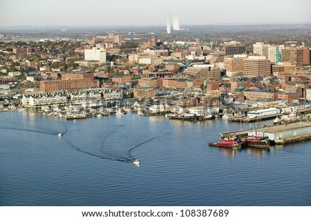 Aerial of downtown Portland Harbor and Portland Maine with view of Maine Medical Center, Commercial street, Old Port and Back Bay.