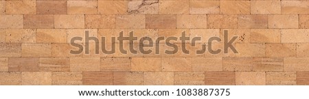 Texture of golden sandstone bricks