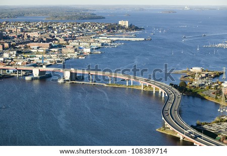 Aerial of downtown Portland, Maine showing Maine Medical Center, Commercial street, Old Port, Back Bay and the Casco Bay Bridge from South Portland