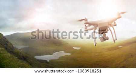 Multicopter drone flying over a scenic landscape in Ireland, Brandon Bay, Dingle peninsula, Co. Kerry, Ireland
