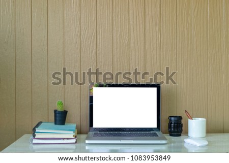 Laptop mockup with office supplies, workspace and copy space.