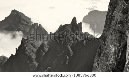Clouds and mountain scenery, mountain landscape, National park in China known for its surreal scenery of rock formations. This image was blurred or selective focus. Black and white picture.
