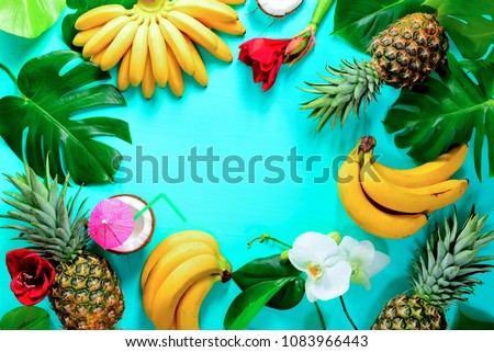 Summer colorfull concept with tropical fruits and flowers, flat lay, space for a text