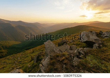 Beautiful summer sunset in Carpathian mountains,dramatic sky clouds and warm evening on mountains range