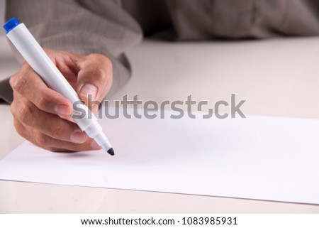 Writing using maker pen on white paper